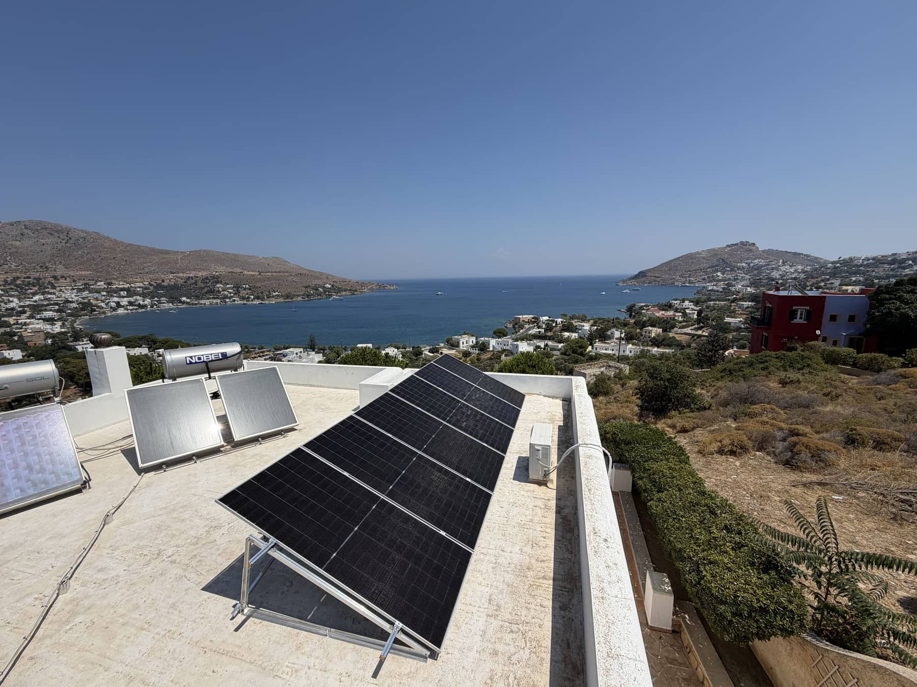 Rooftop photovoltaic system above a bay, Leros